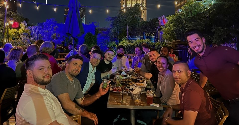 Members at a rooftop dinner in NYC