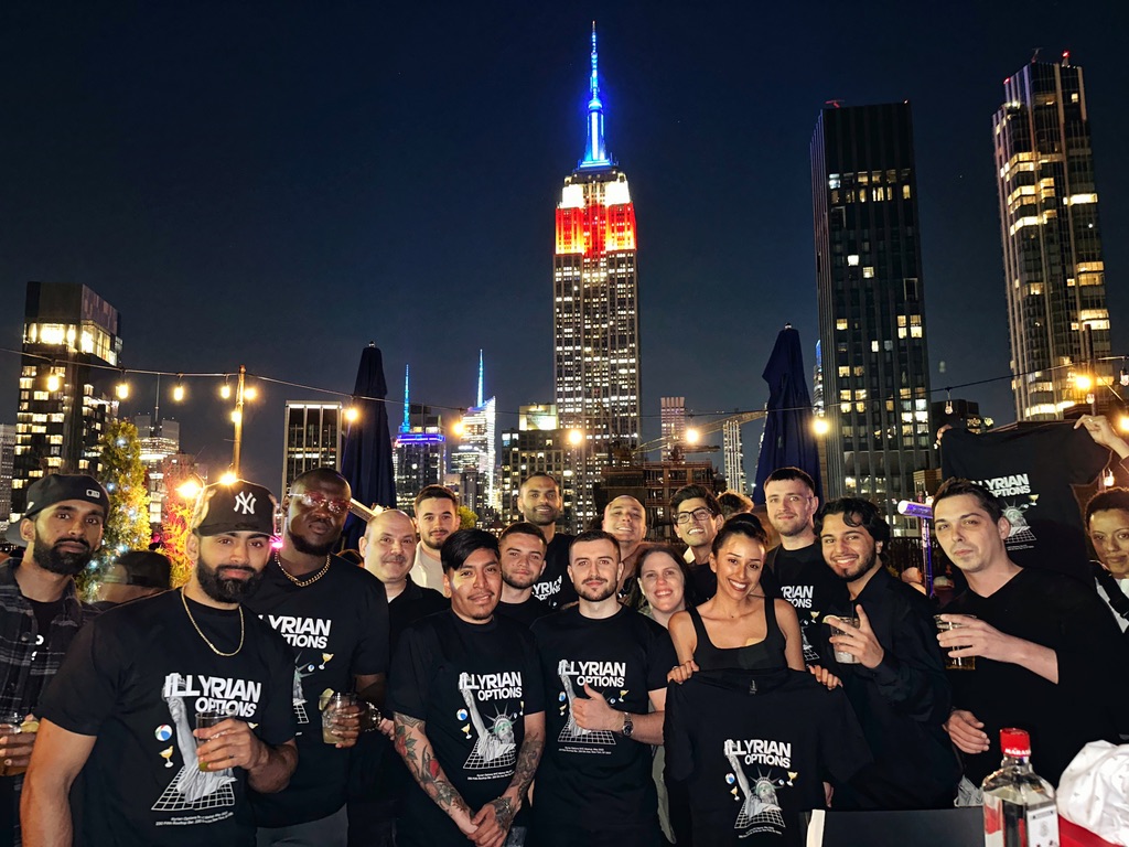 Members on a NYC rooftop in Illyrian Options shirts